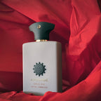 Amouage Opus XIV Royal Tobacco perfume bottle on red fabric