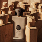 Amouage Opus XVI Timber perfume bottle surrounded by wooden blocks