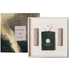 Amouage Purpose perfume gift set featuring a dark green rectangular bottle with a white cap, flanked by two beige textured spray bottles, presented in a cream-colored box next to its gold and black glitter-patterned outer packaging.