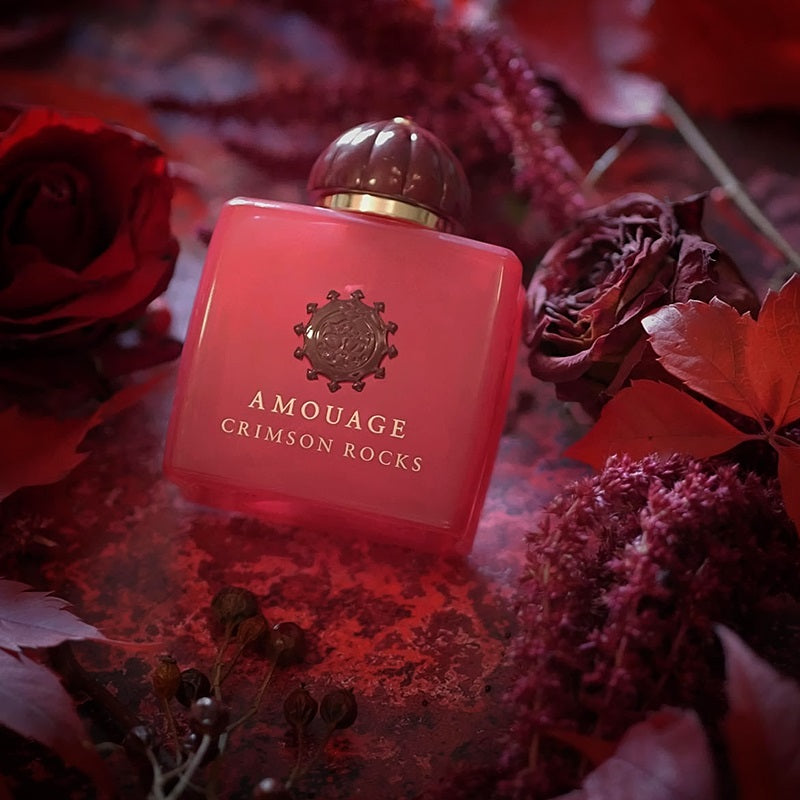 Promotional Bottle of 100ml of Amouage Crimson rocks, encased in roses