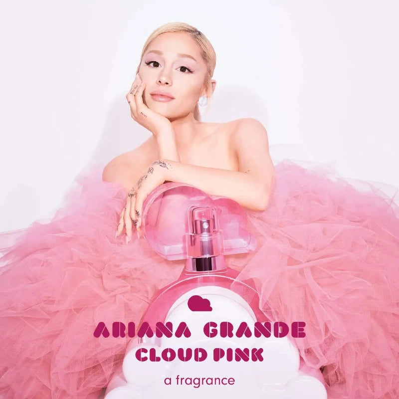 Ariana Grande in a pink dress with 'Cloud Pink' perfume bottle on a white background
