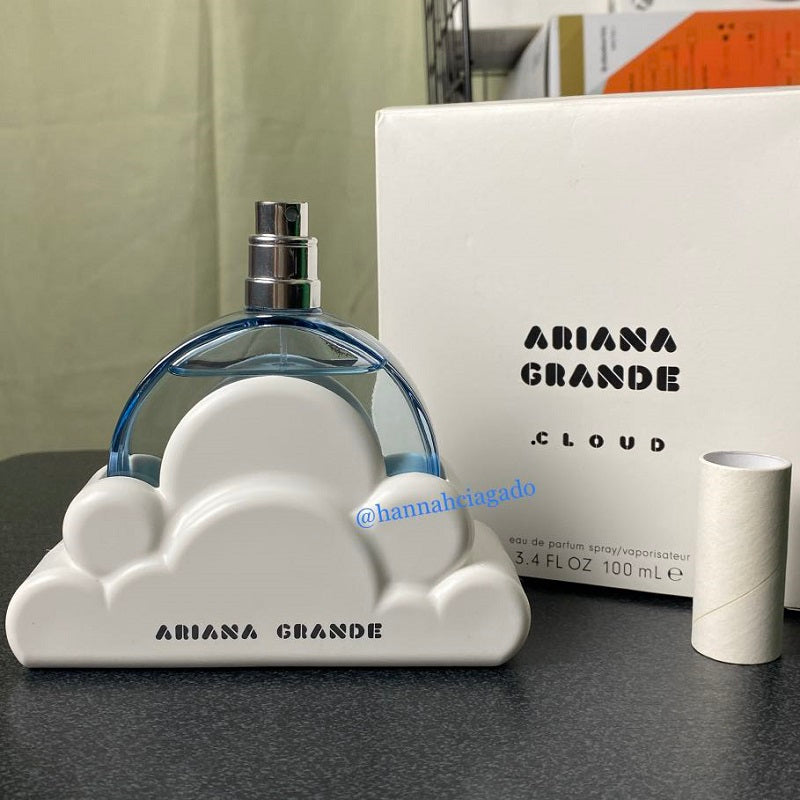 Ariana Grande Cloud perfume bottle and packaging on a table
