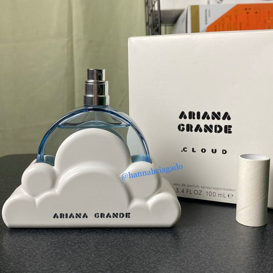 Ariana Grande Cloud perfume bottle and packaging on a table