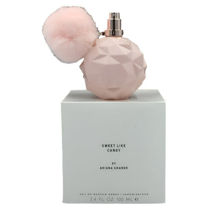 Ariana Grande's 'Sweet Like Candy' eau de parfum tester, featuring a pink faceted bottle with a removable pink top and a white box with the product name and brand.