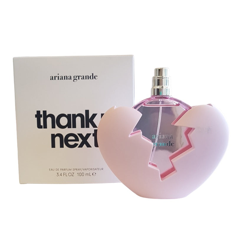 Ariana Grande's 'Thank U Next' Eau de Parfum in a pink heart-shaped bottle with a spray nozzle, accompanied by its white box packaging with the product name and Ariana Grande's signature.