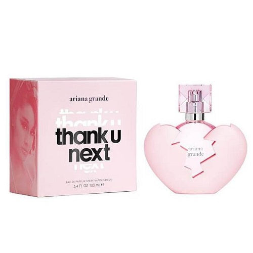 Ariana Grande's 'Thank U Next' perfume in a pink heart-shaped bottle with the corresponding perfume box, both featuring the name 'thank u next' on the front.