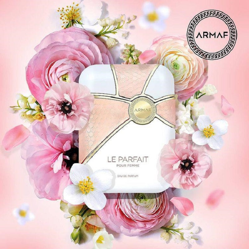 ARMAF perfume bottle surrounded by pink flowers on a pink background