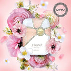 ARMAF perfume bottle surrounded by pink flowers on a pink background
