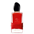 Red Giorgio Armani perfume bottle with black cap on a white background