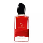 Red Giorgio Armani perfume bottle with black cap on a white background