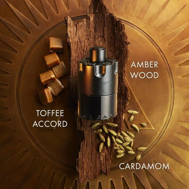 Vape device with amber wood, toffee accord, and cardamom elements on a decorative background