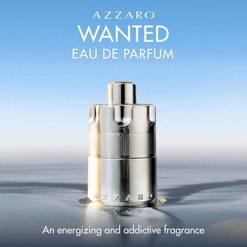 Azzaro Wanted Eau de Parfum bottle on a gradient blue and gray background