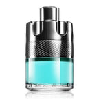A bottle of Wanted Tonic Man Eau de Toilette by Azzaro with a clear blue liquid visible and a metallic cap.