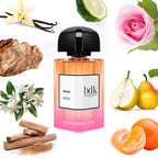 Bottle of bdk Parfums with floral, fruit, and spice elements on a white background