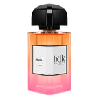 Perfume bottle with gradient design and black cap on a white background