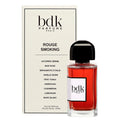Bdk Parfums Paris Rouge Smoking Eau de Parfum bottle with red liquid and a black cap, shown next to its cream-colored packaging box.