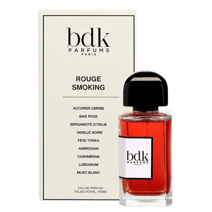 Bdk Parfums Paris Rouge Smoking Eau de Parfum bottle with red liquid and a black cap, shown next to its cream-colored packaging box.