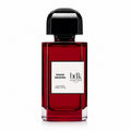 A bottle of hdlk Parfums Rouge Smoking Eau de Parfum, featuring a deep red glass bottle with a black cap and a white label, set against a plain white background.