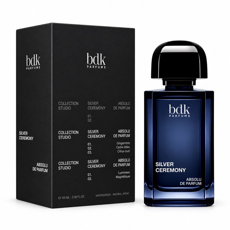 BDK Parfums Silver Ceremony 100ml Absolu de Parfum deep blue bottle beside its black Collection Studio presentation box with contrasting typography on a clean white background
