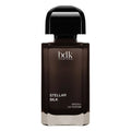 A bottle of BDK Parfums Stellar Silk Absolu de Parfum, featuring a dark brown glass bottle with a glossy black cap, set against a plain white background.