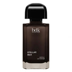A bottle of BDK Parfums Stellar Silk Absolu de Parfum, featuring a dark brown glass bottle with a glossy black cap, set against a plain white background.