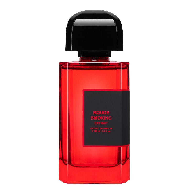 A red qooml bottle of Rouge Smoking Extrait Eau de Parfum by BDK Parfums with a black cap and label.
