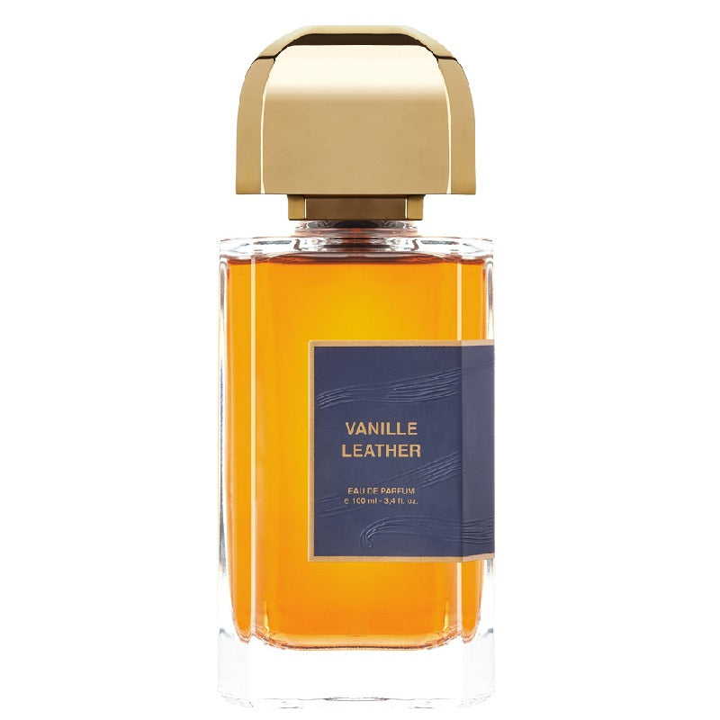 A bottle of Vanille Leather Eau De Parfum by BDK with a clear, amber-colored liquid visible and a navy label Logo
