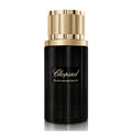 Chopard Black Incense Malaki perfume bottle with gold cap on a white background