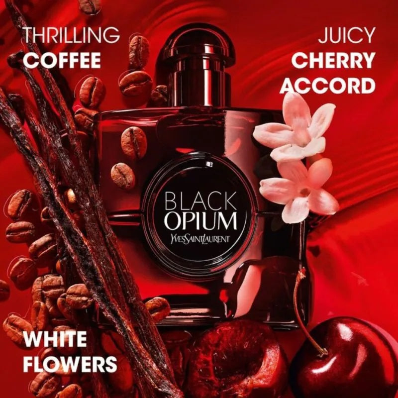 Yves Saint Laurent Black Opium perfume bottle with coffee beans, cherry, and flowers on a red background