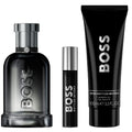 BOSS perfume set with a bottle, rollerball, and shower gel on a white background