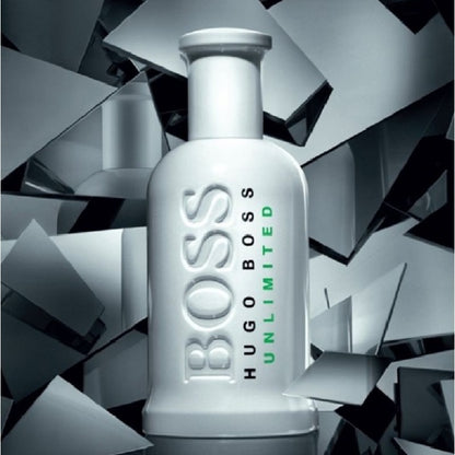 Hugo Boss Unlimited perfume bottle on a geometric background