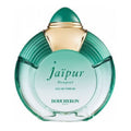 A glass perfume bottle with a green hue and gold accents on the cap, labeled 'Jaipur Bouquet' by Boucheron.