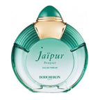 A glass perfume bottle with a green hue and gold accents on the cap, labeled 'Jaipur Bouquet' by Boucheron.