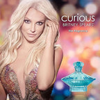 Advertisement for Britney Spears' 'Curious' fragrance with a colorful background