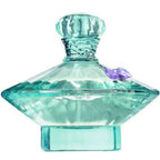 Turquoise perfume bottle with decorative cap on a white background