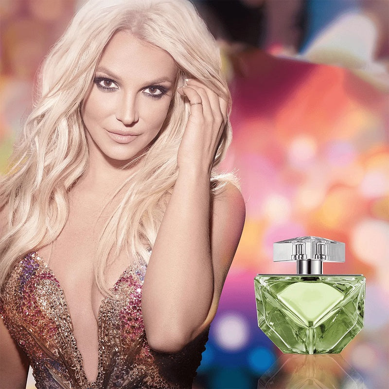 Woman with a colorful background and a green perfume bottle