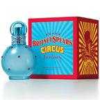 Blue perfume bottle with red polka dots and matching box featuring 'Britney Spears Circus Fantasy' on a white background.