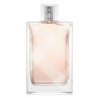 Clear perfume bottle with pink liquid on a white background
