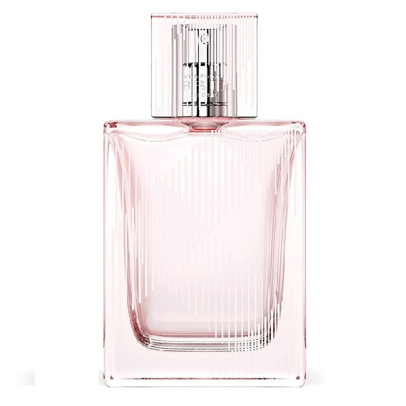 A glass bottle of Burberry Brit Sheer Eau de Toilette with a pink hue and a transparent cap.
