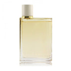 A bottle of Burberry Her London Dream Eau de Parfum with a clear yellow liquid visible and a white cap.