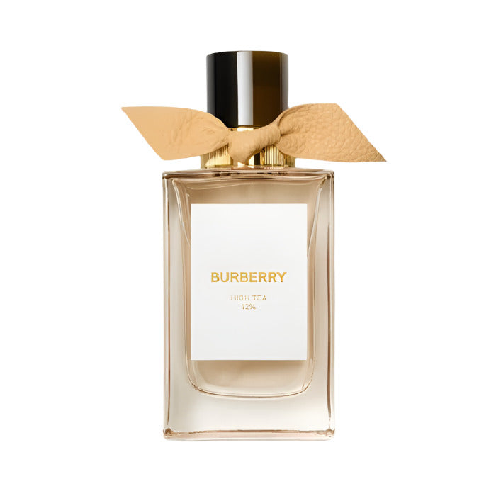 Burberry perfume bottle with a gold bow on a white background