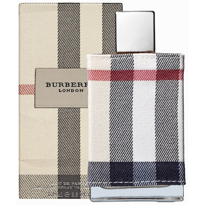 Burberry London Eau de Parfum bottle with striped beige and navy fabric in the background.