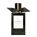Bottle of Burberry Midnight Journey Eau de Parfum with a black label and a silver cap, adorned with a black bow.