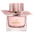 Burberry perfume bottle with pink cap and ribbon on a white background