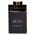 A bottle of Bvlgari Man In Black Eau de Parfum with a dark label and gold text.