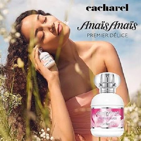 Woman holding a Cacharel perfume bottle with a scenic background
