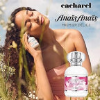 Woman holding a Cacharel perfume bottle with a scenic background