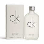 Calvin Klein CK One Eau de Toilette bottle and its matching packaging box, both in a minimalist off-white color with black logo branding.