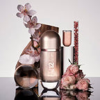 Perfume bottle labeled '12 VIP' with flowers and decorative elements on a reflective surface.