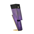 A purple bottle of Bad Boy Dazzling Garden Eau de Parfum by Carolina Herrera, designed with an abstract and geometric shape.